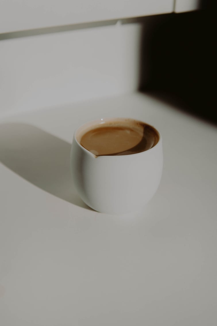 Drink in a Cup on a White Surface