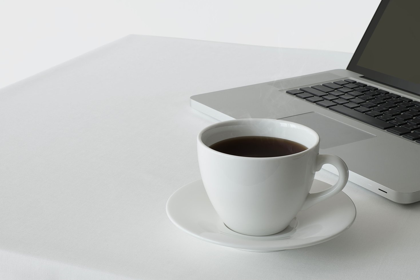 Coffee cup with laptop computer